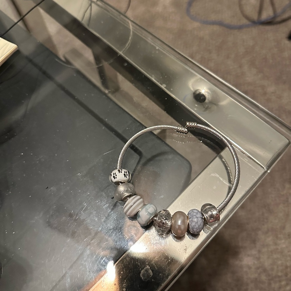 Silver bracelet with charms